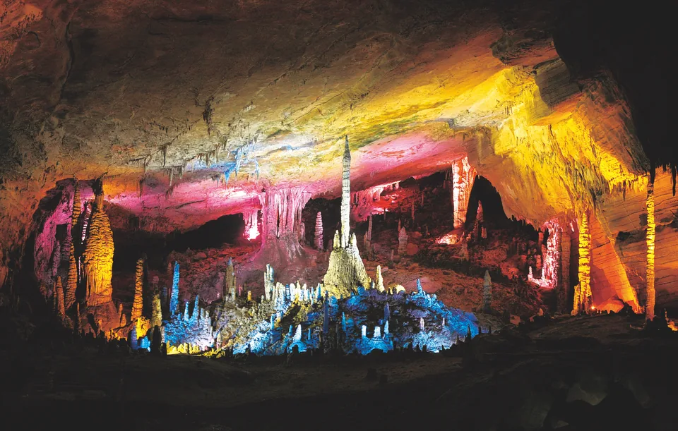 Illuminated stalactites and stalagmites in Huanglong Cave