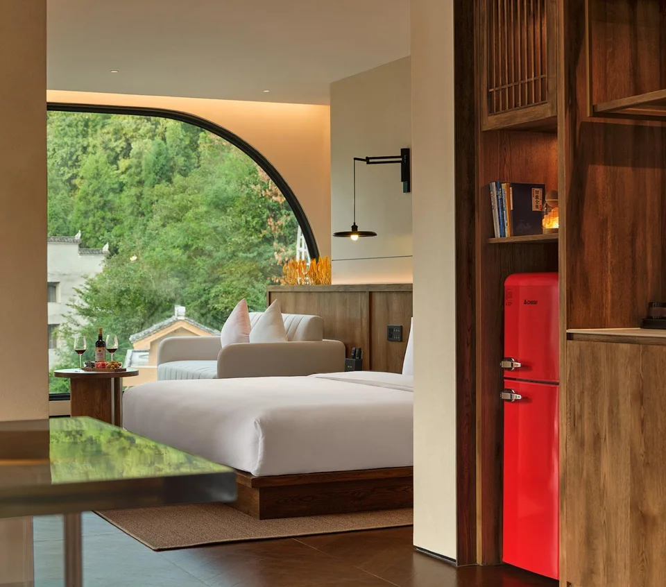 Double bed and window view in a suite