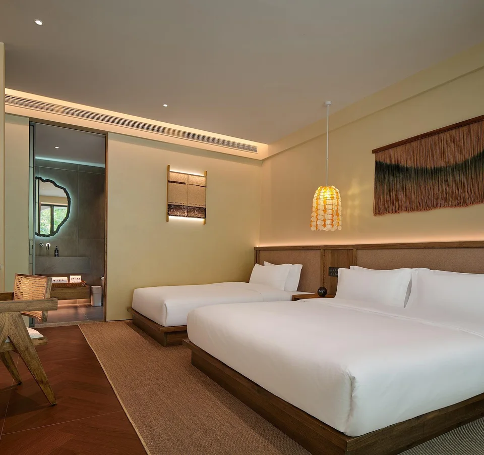 Beds and projection screen in a family suite