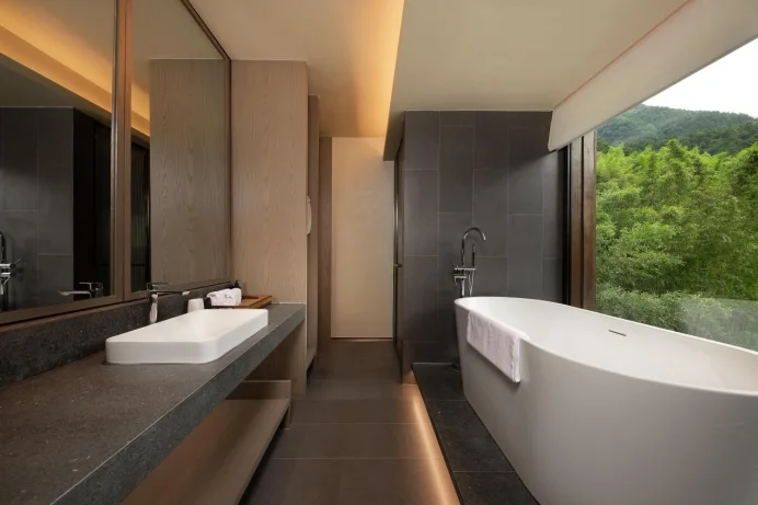 Guest-room bathtub and mountain view through the window