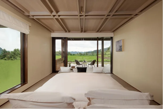 Double bed and window view in a guest room