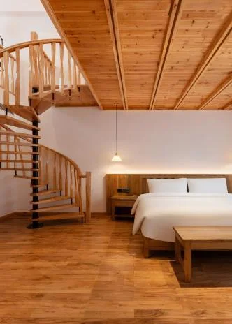 Wood-finished duplex suite at Shangu Mijing Resort Hotel