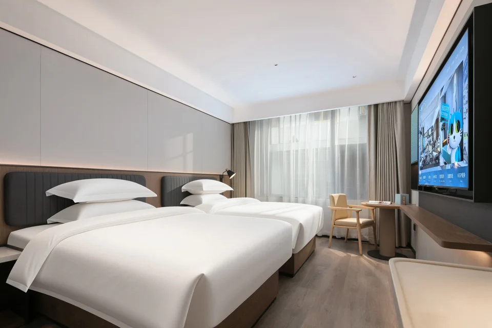 Bright twin room at Echarm Hotel