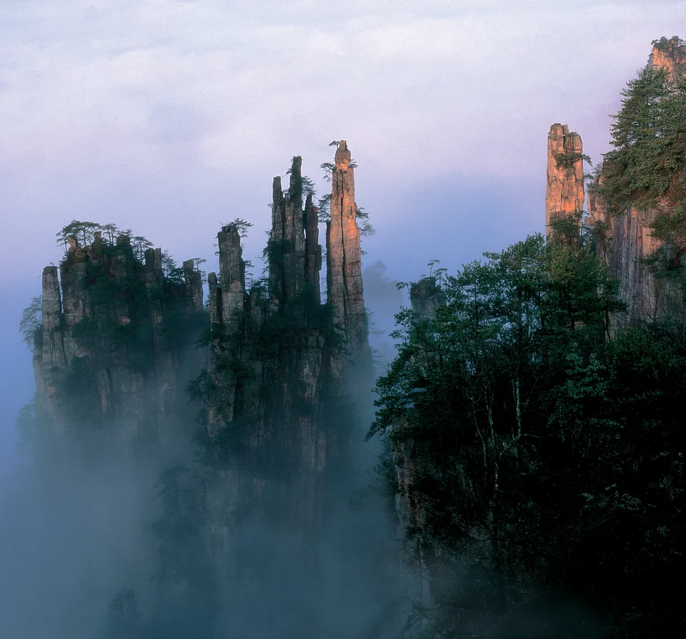 Morning light on Wulingyuan's sandstone peaks and mist