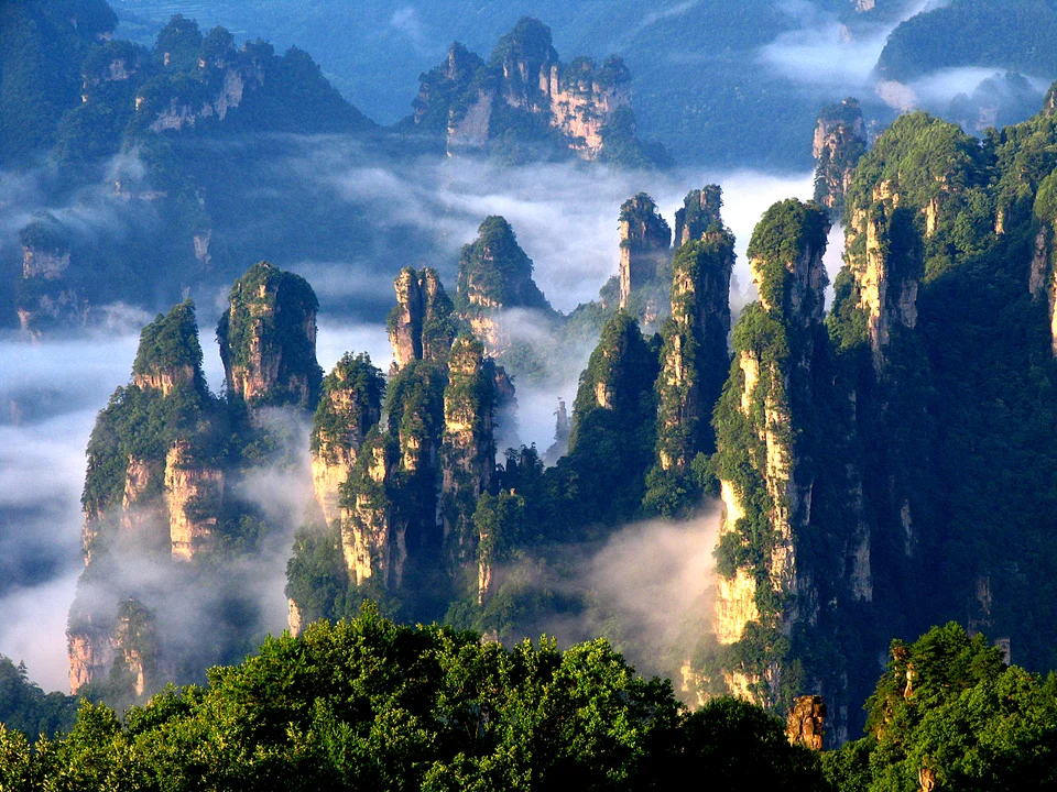 Wulingyuan sandstone peaks in mist and sunlight