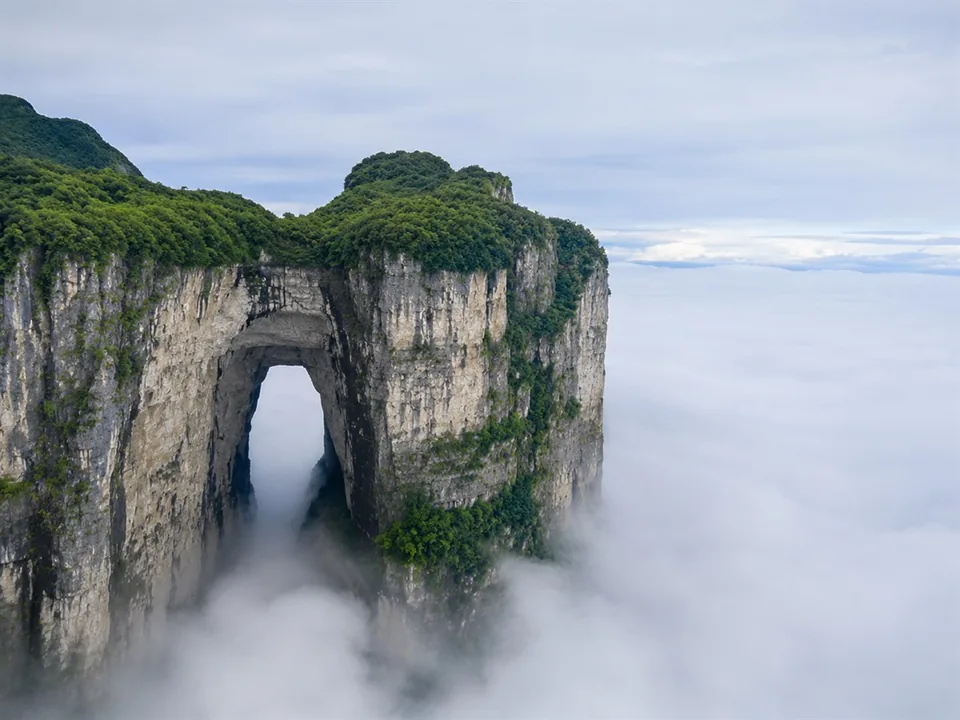 Tianmen Cave and cliffs surrounded by a sea of clouds